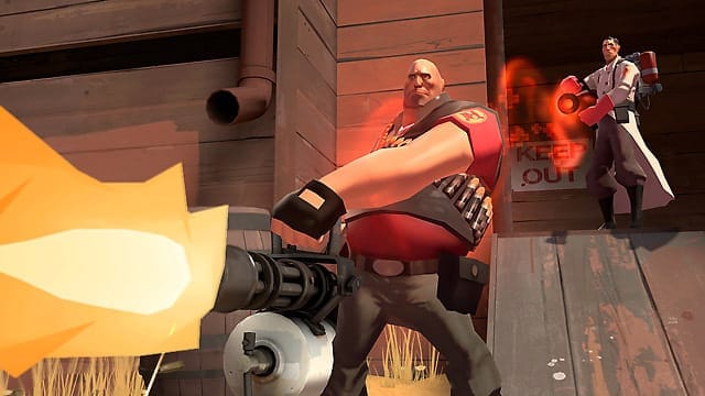 A screenshot from Team Fortress 2 depicting The Heavy in the foreground with his Minigun, and The Medic in the background, firing a healing beam at The Heavy.