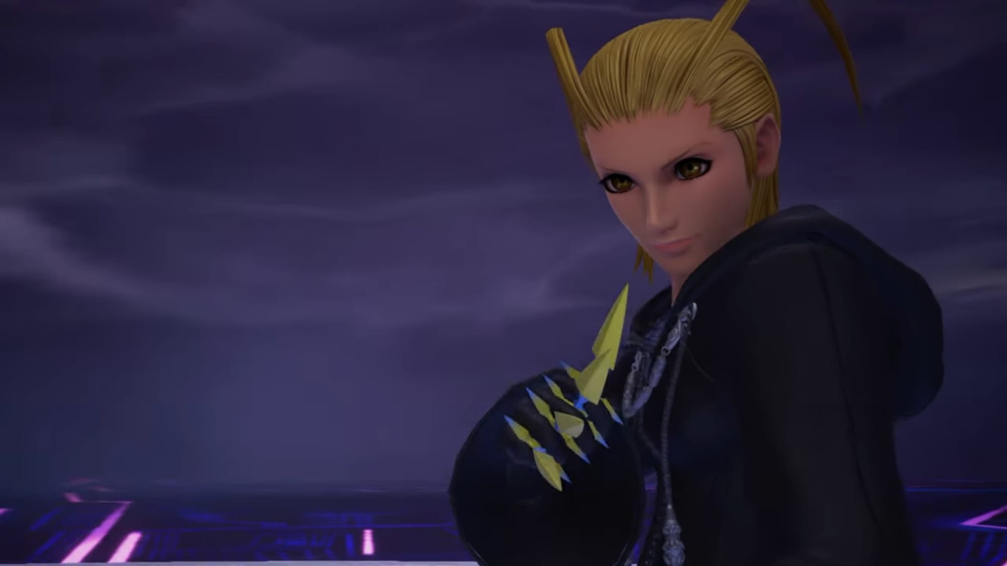 Larxene, a blonde woman in a long black cloak, lifts up her right hand, which is full of knives.