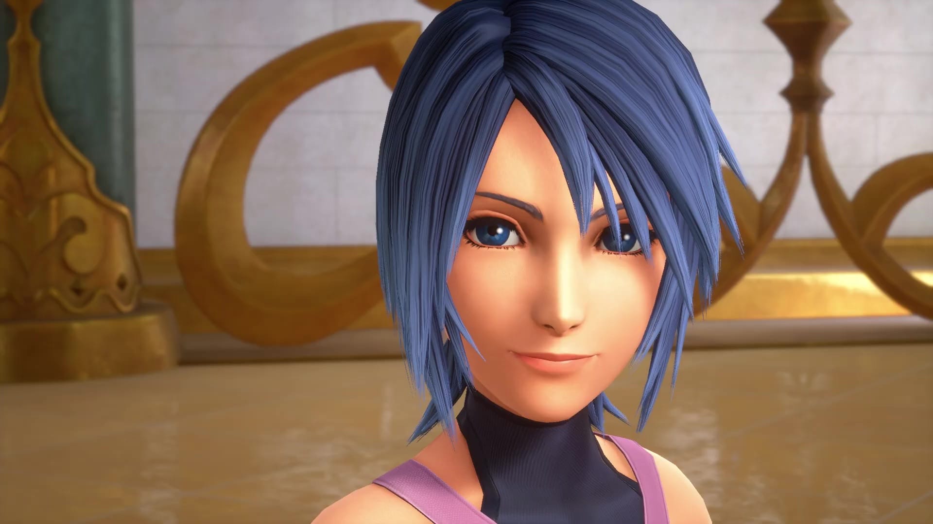 Aqua, a woman with blue hair and blue eyes, smiles at the viewer