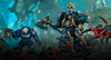A promotional image for Warhammer 40K featuring two Space Marines fighting some Tyranids