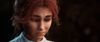 Maelle, a young woman with red hair, looks downcast