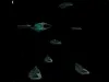 A wide shot of outer space, where eight identical spaceships float. There's an anomaly that looks like a black hole far in the distance.