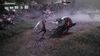 Hazel fights a nebulus, tentacled monster in a desolate field. She raises her weapon over her head mid-jump. The monster has half its life left.
