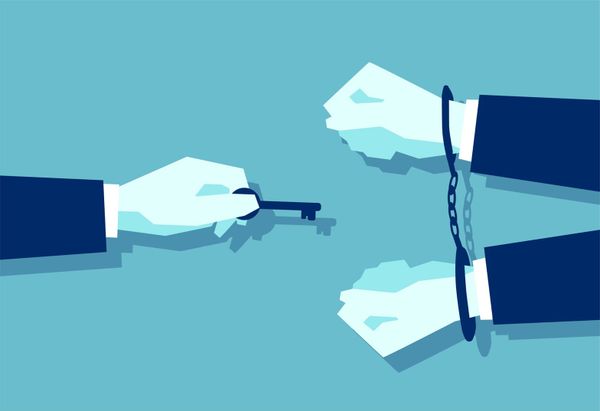 a man with a key reaching out to a man in handcuffs