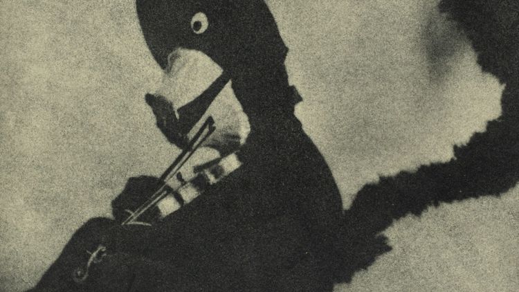 black and white art depicting a shadowy puppet-like cat playing a fiddle