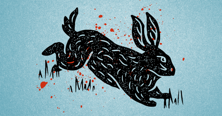 A black print of a rabbit on a blue background, surrounded by drops of blood. 