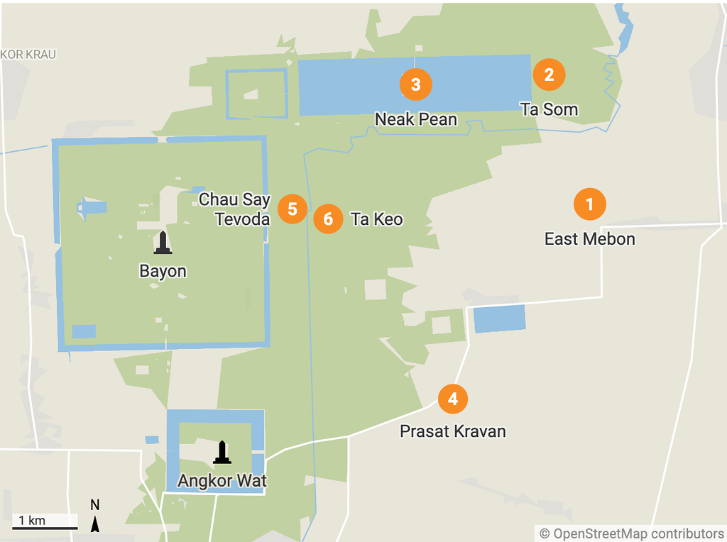 Small temple ruins surrounded by lush vegetation in the Angkor Archaeological Park, Cambodia