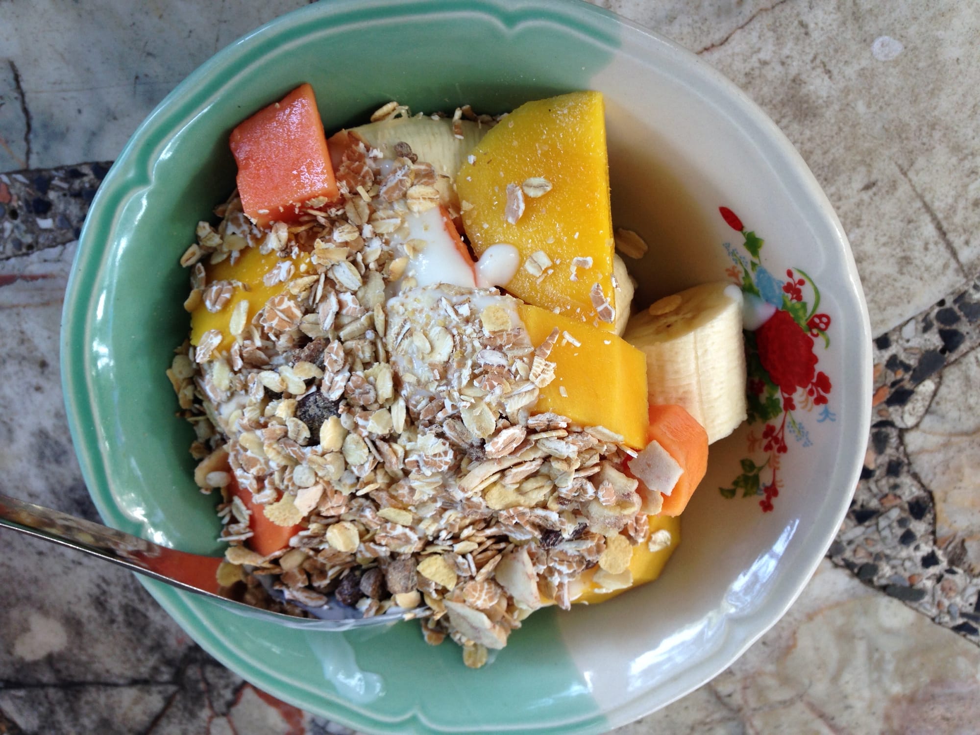 Fresh fruit bowl with yoghurt and muesli breakfast on Koh Tao island Thailand