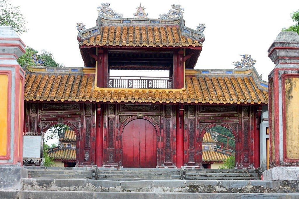 Overgrown ruins of Gia Long Imperial Tomb in the forest near Hue