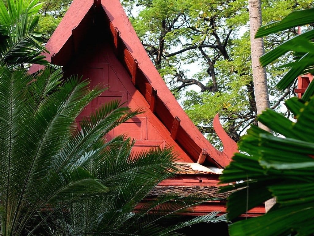 Traditional Thai stilted house and lush tropical garden at Jim Thompson House