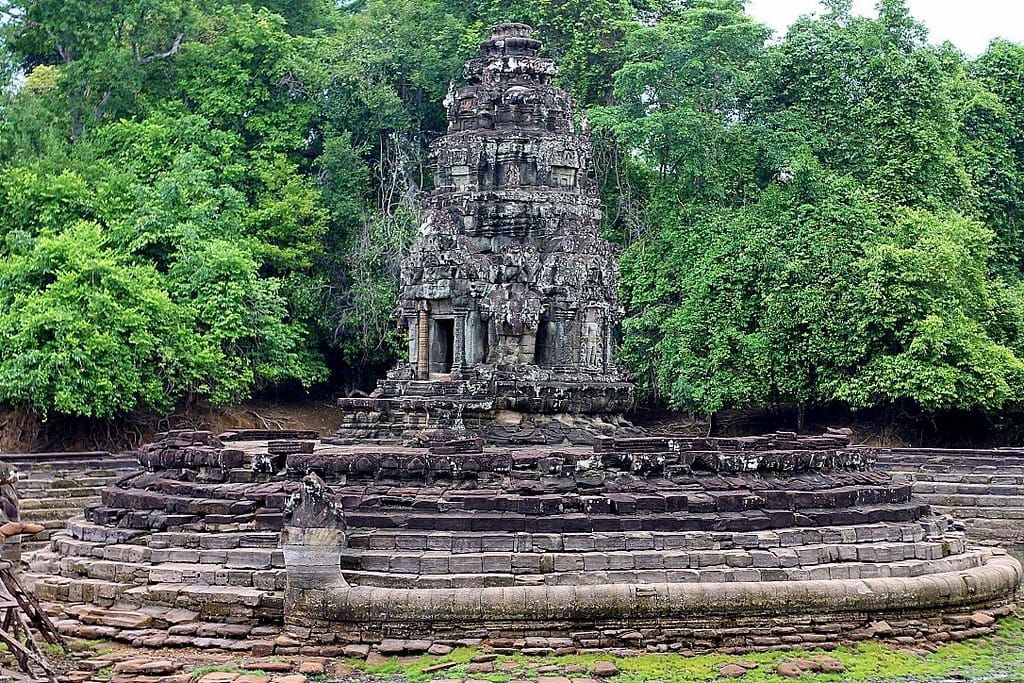Neak Pean temple on a small island surrounded by a tranquil lake at Angkor, Cambodia