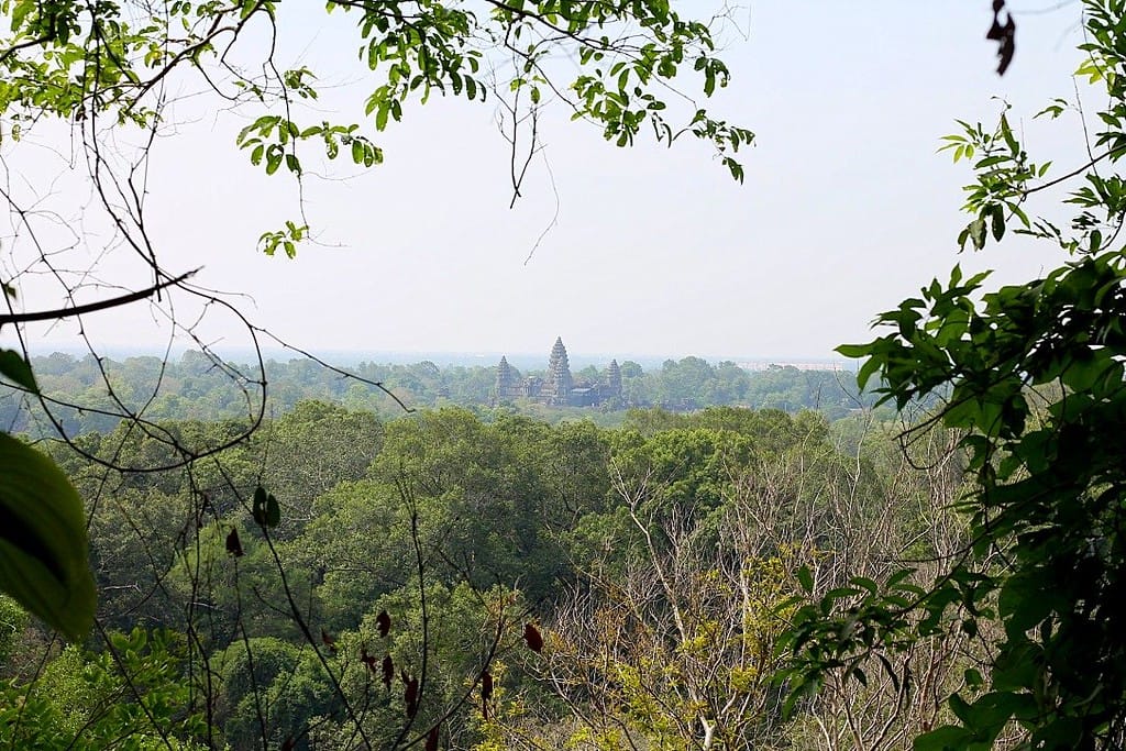 Panoramic view of Angkor Wat temple from Phnom Bakheng hill at sunset in Siem Reap