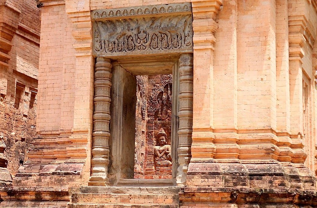 The brick towers of Prasat Kravan temple with carved bas-reliefs at Angkor, Cambodia