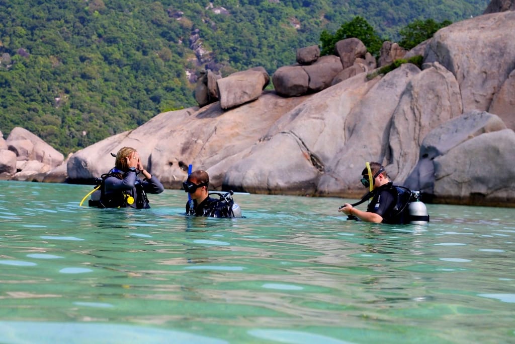 Snorkeling in crystal clear turquoise waters around Koh Nang Yuan coral reefs