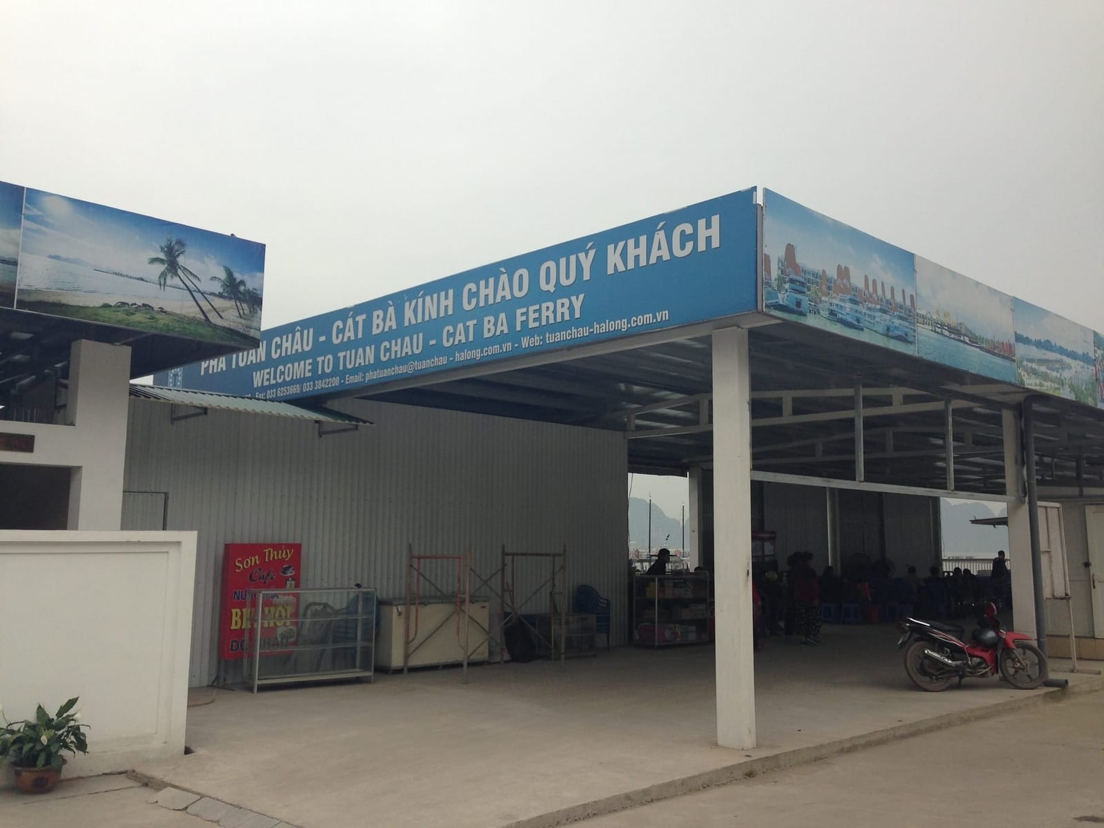 Tuan Chau ferry terminal building with boats
