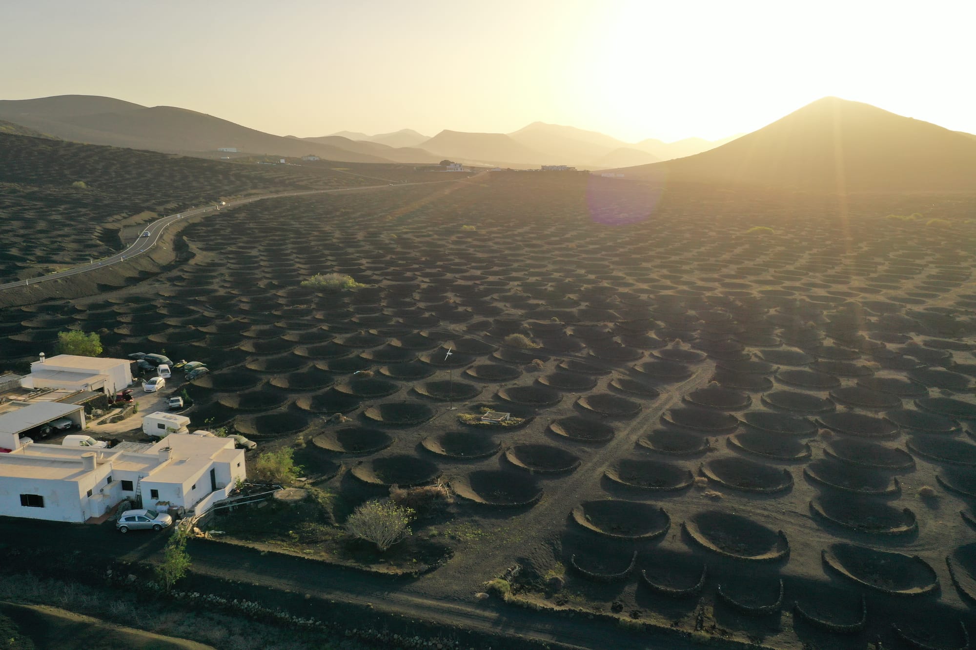 Aerial view of Puerto del Carmen showing the long sandy beach, resort buildings and turquoise waters — Lanzarote