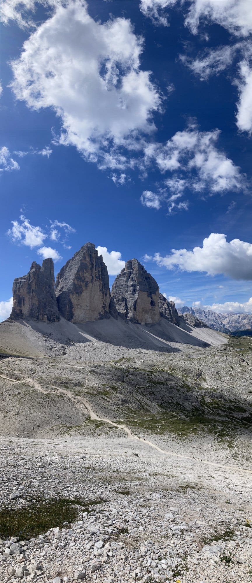 The iconic Tre Cime di Lavaredo south face with hiking trail in the foreground — Dolomites, Italy