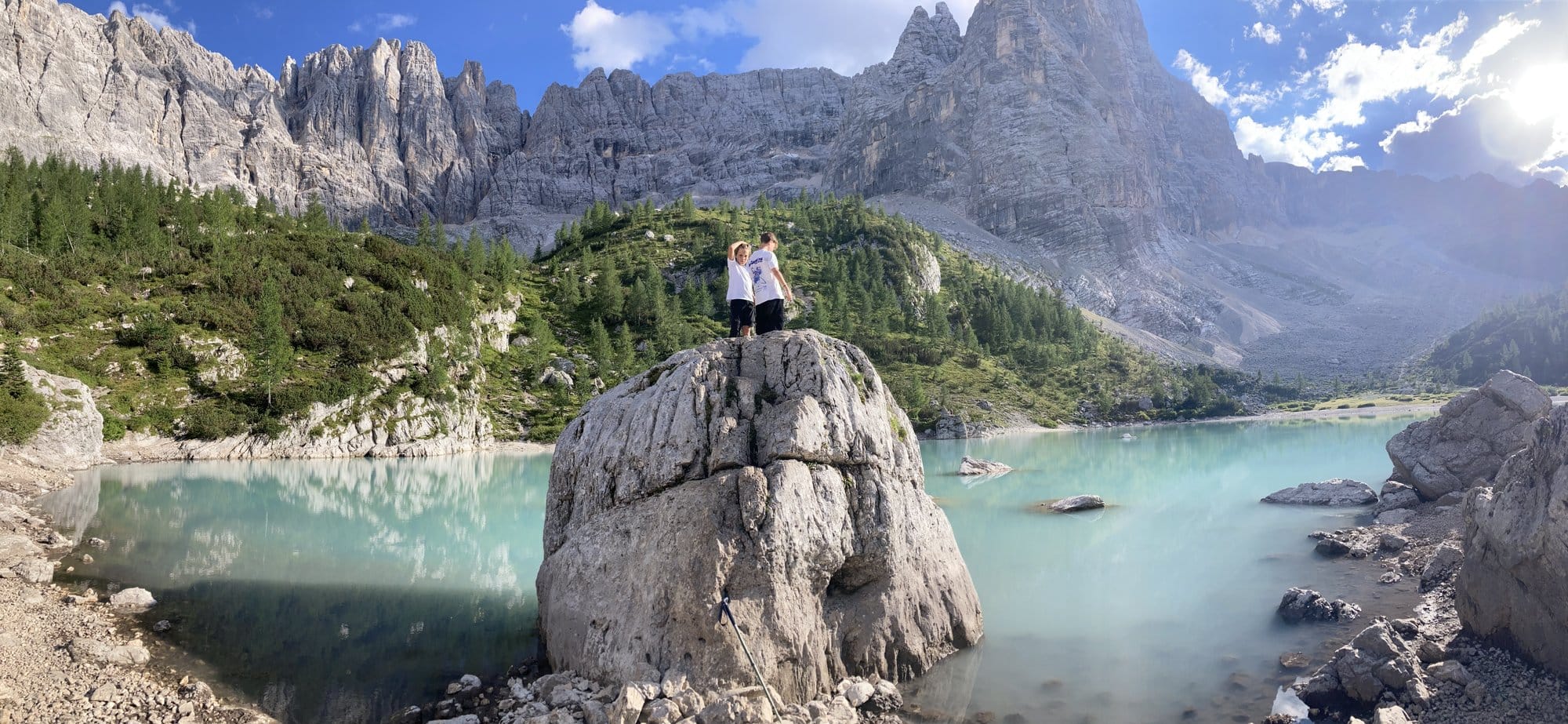 Wide-angle view of Lago di Sorapis showing the full amphitheater of Dolomite cliffs — Dolomites, Italy