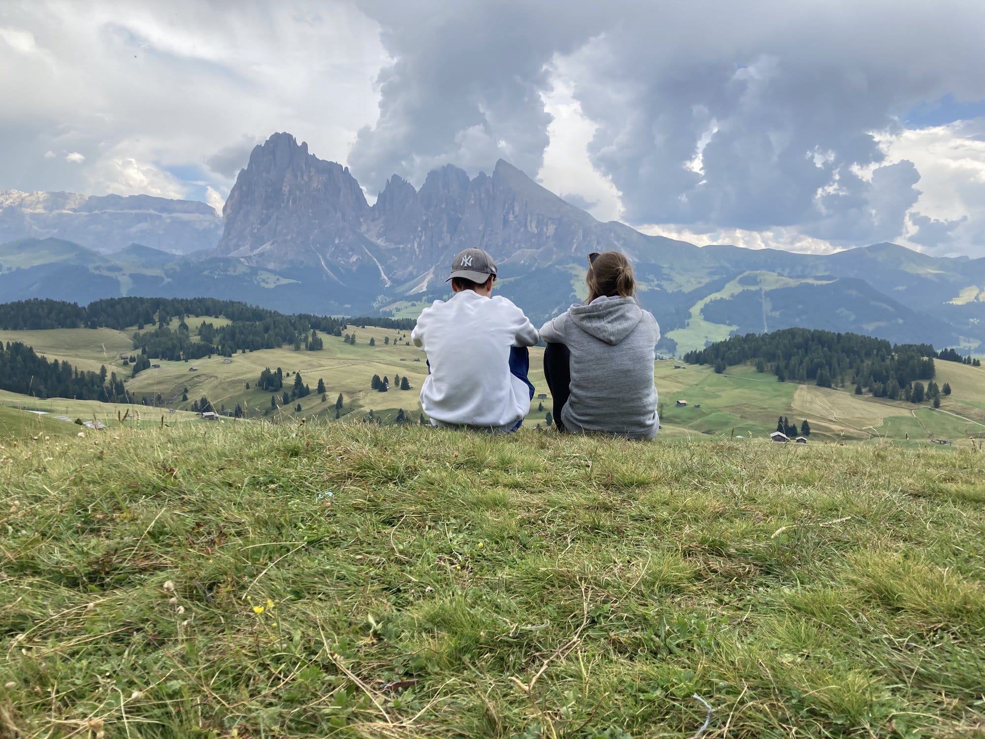 Contemplating the Sassolungo massif from the meadows of Alpe di Siusi โ Dolomites, Italy