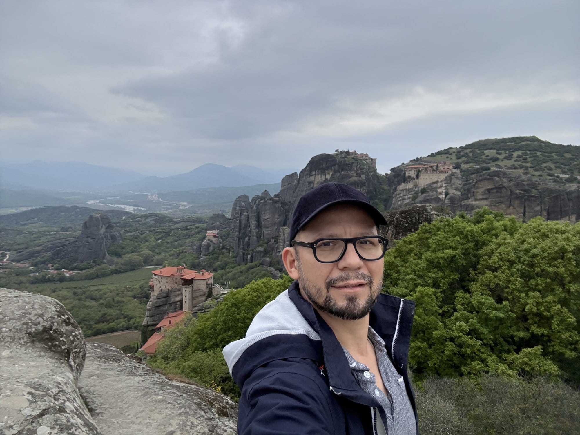 Selfie with two Meteora monasteries (Varlaam and Roussanou) on their rocks behind — Greece