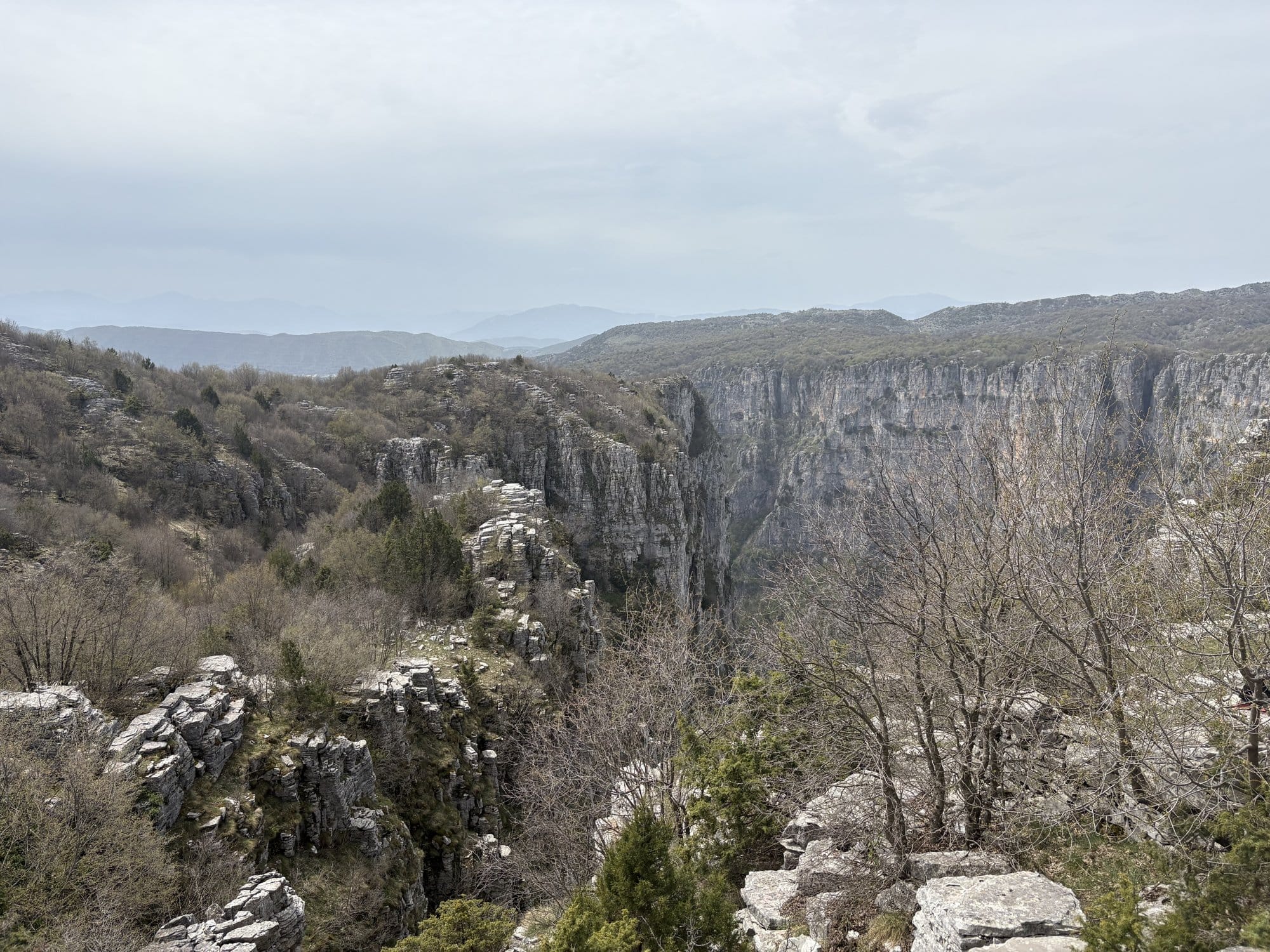 Panoramic view from the Beloi rim into the upper Vikos Gorge — Zagori, Greece