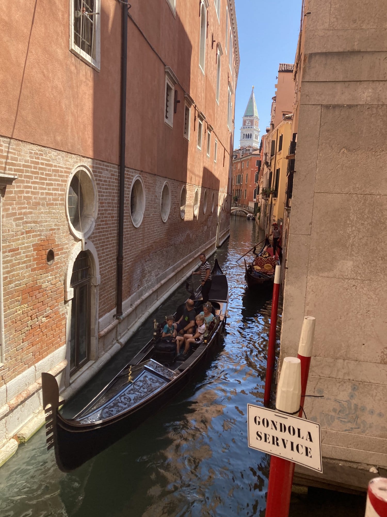 Gondola service station with the campanile of San Marco visible in the background — Venice, Italy