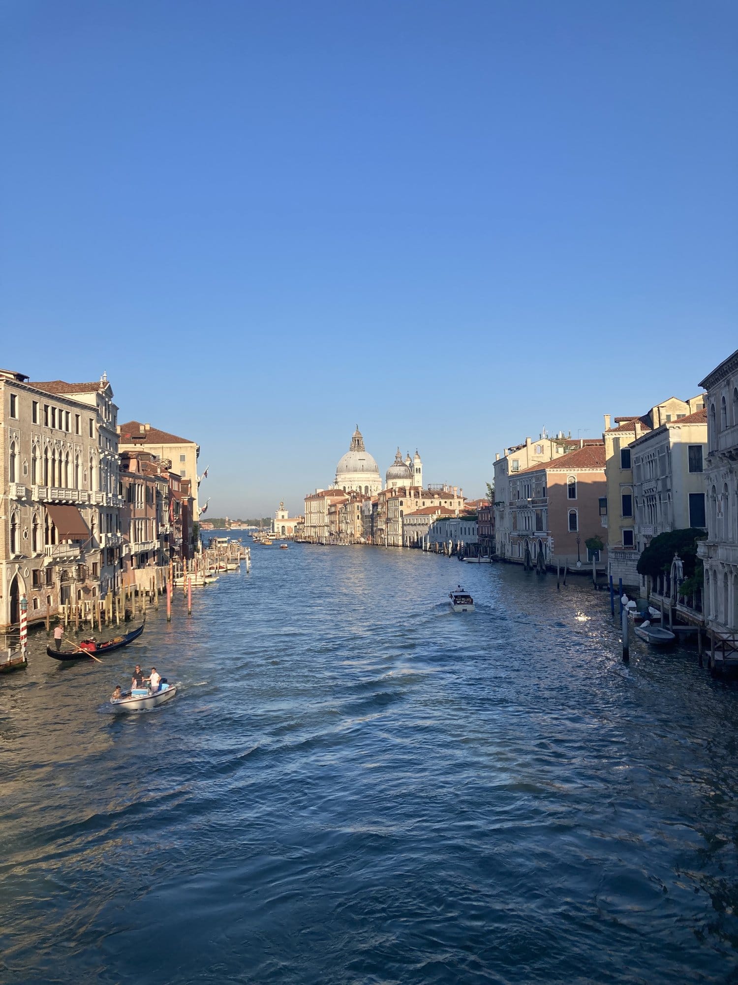 Grand Canal at golden hour with Basilica della Salute in the background — Venice, Italy