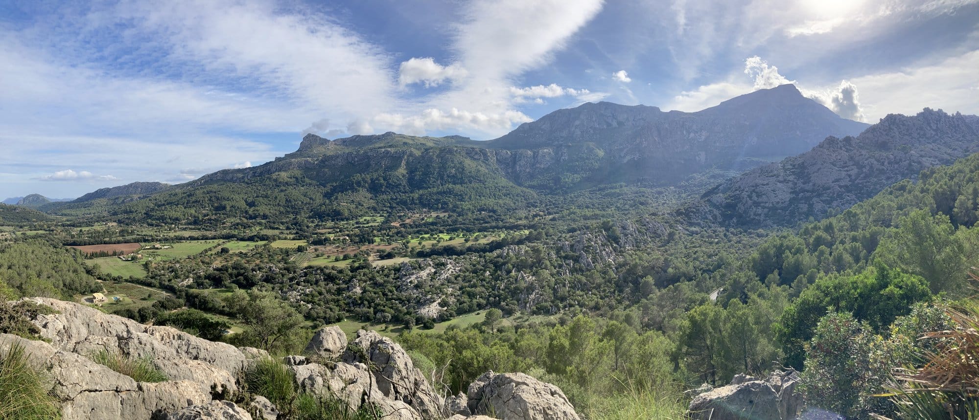 Limestone ridges and distant coastline from the mountain pass — Serra de Tramuntana, Spain