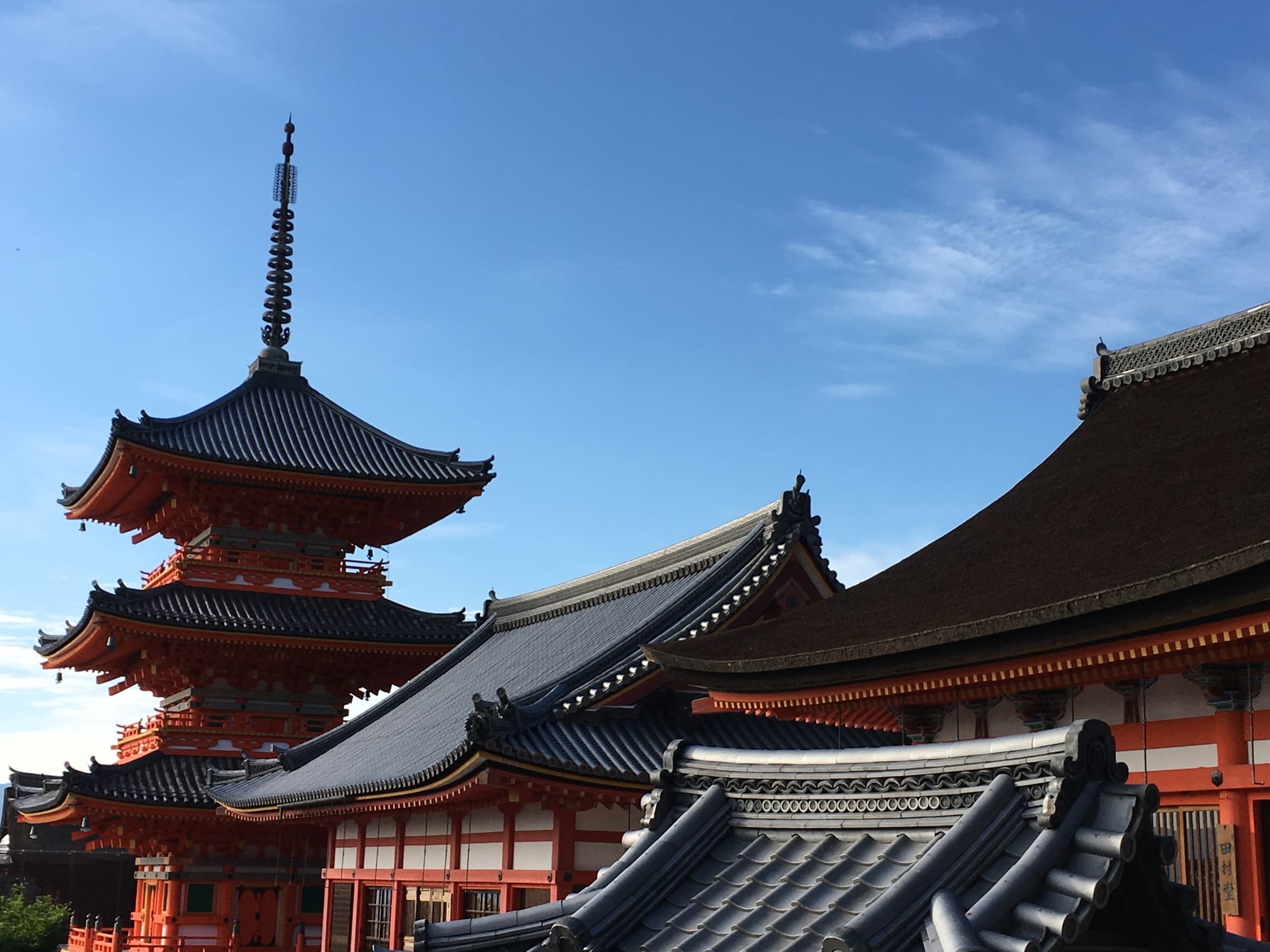 The three-storied pagoda and roofs of Kiyomizu-dera against the Higashiyama sky — Kyoto, Japan