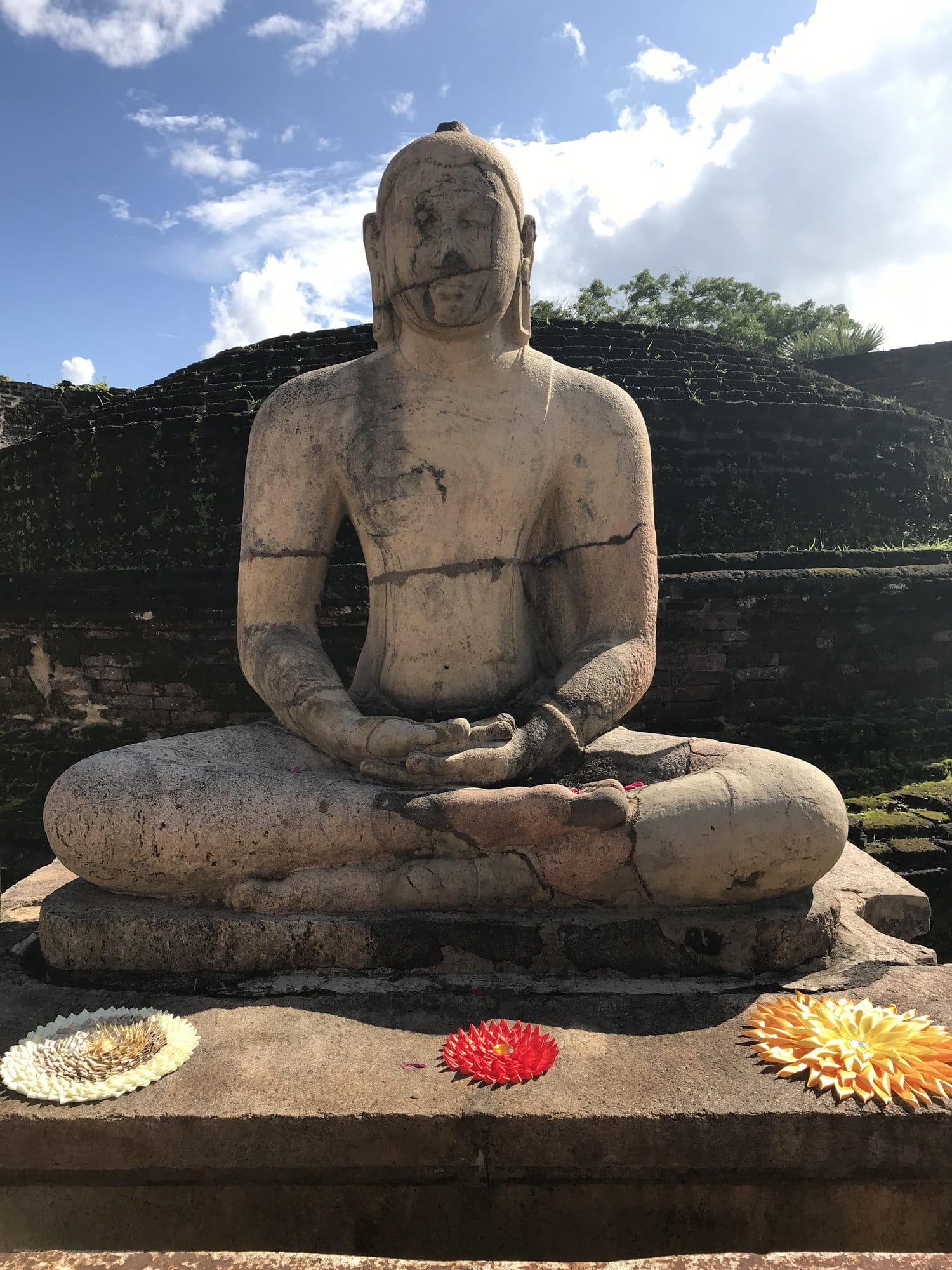 Ceramic pans filled with golden curries simmering over traditional charcoal cooking setup, steam rising from each vessel — Polonnaruwa region, Sri Lanka