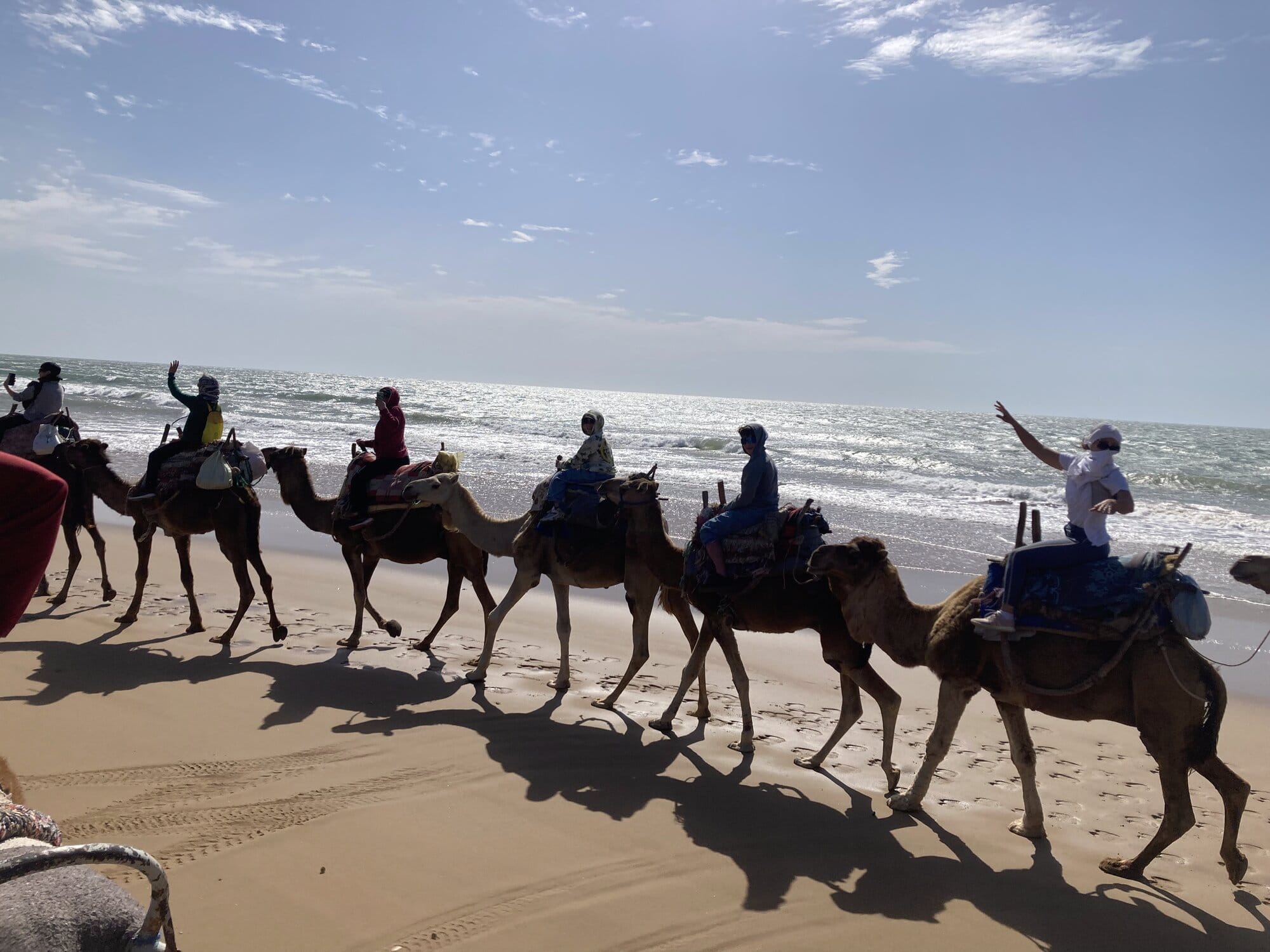 The coastal road south of Essaouira in late-afternoon golden light — Essaouira, Morocco