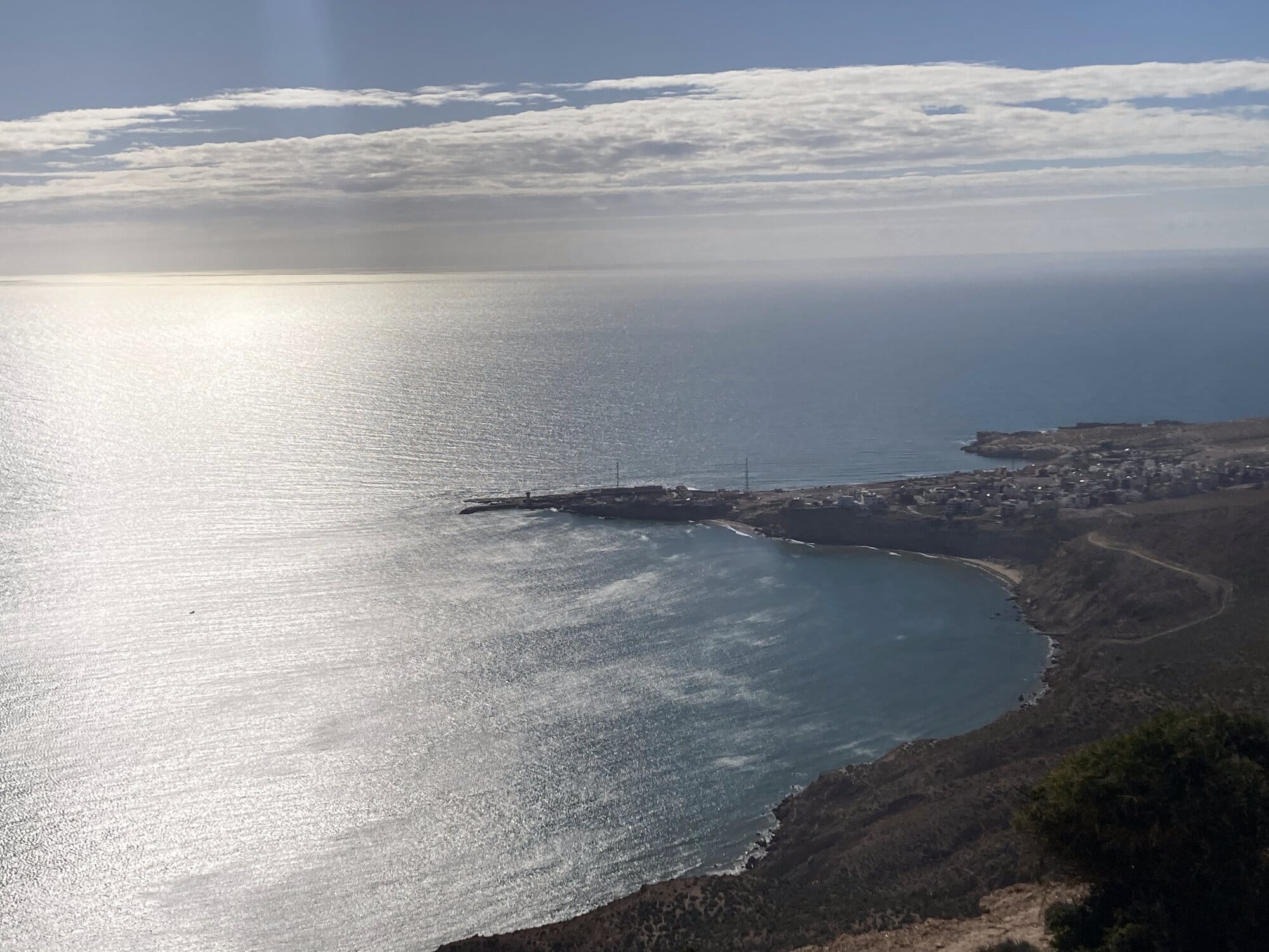 A high viewpoint over a small fishing port nestled on the Atlantic coast between Tamri and Imsouane — southern Morocco