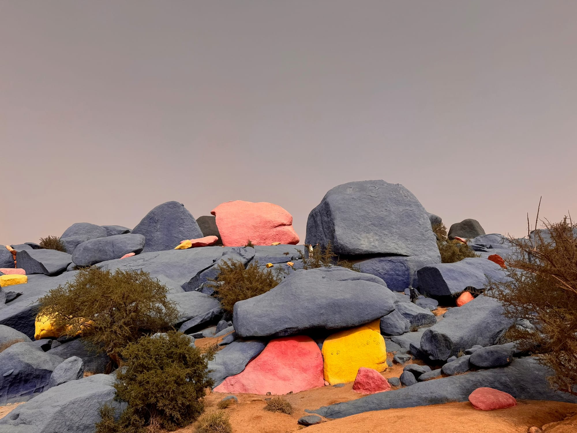 The Painted Rocks of Tafraout — giant granite boulders washed in blue, red and yellow by Jean Vérame in 1984 — near Tafraout, Morocco