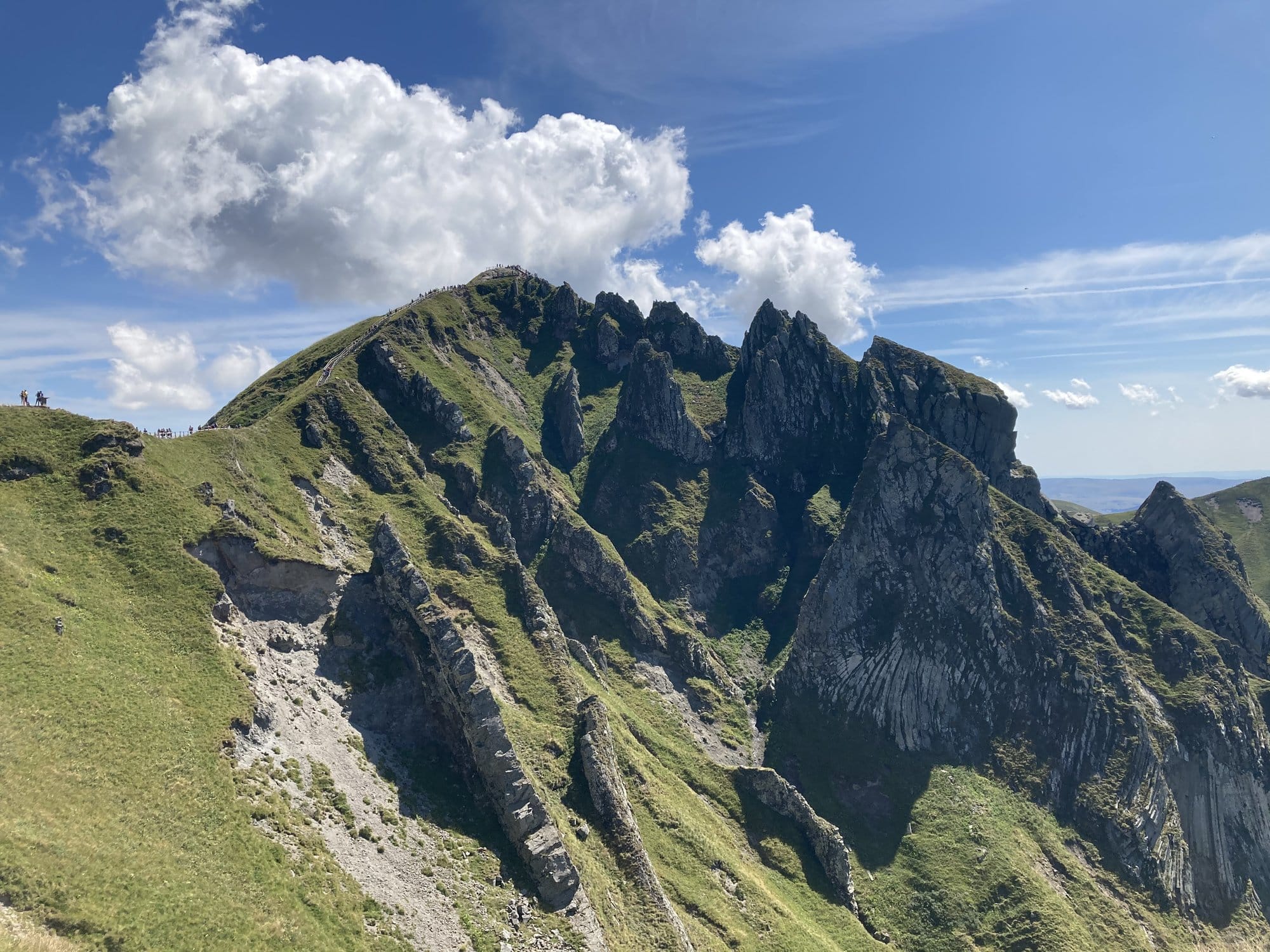 Jagged volcanic crags along the summit ridge of Puy de Sancy, with sweeping views across the Massif Central — Auvergne, France