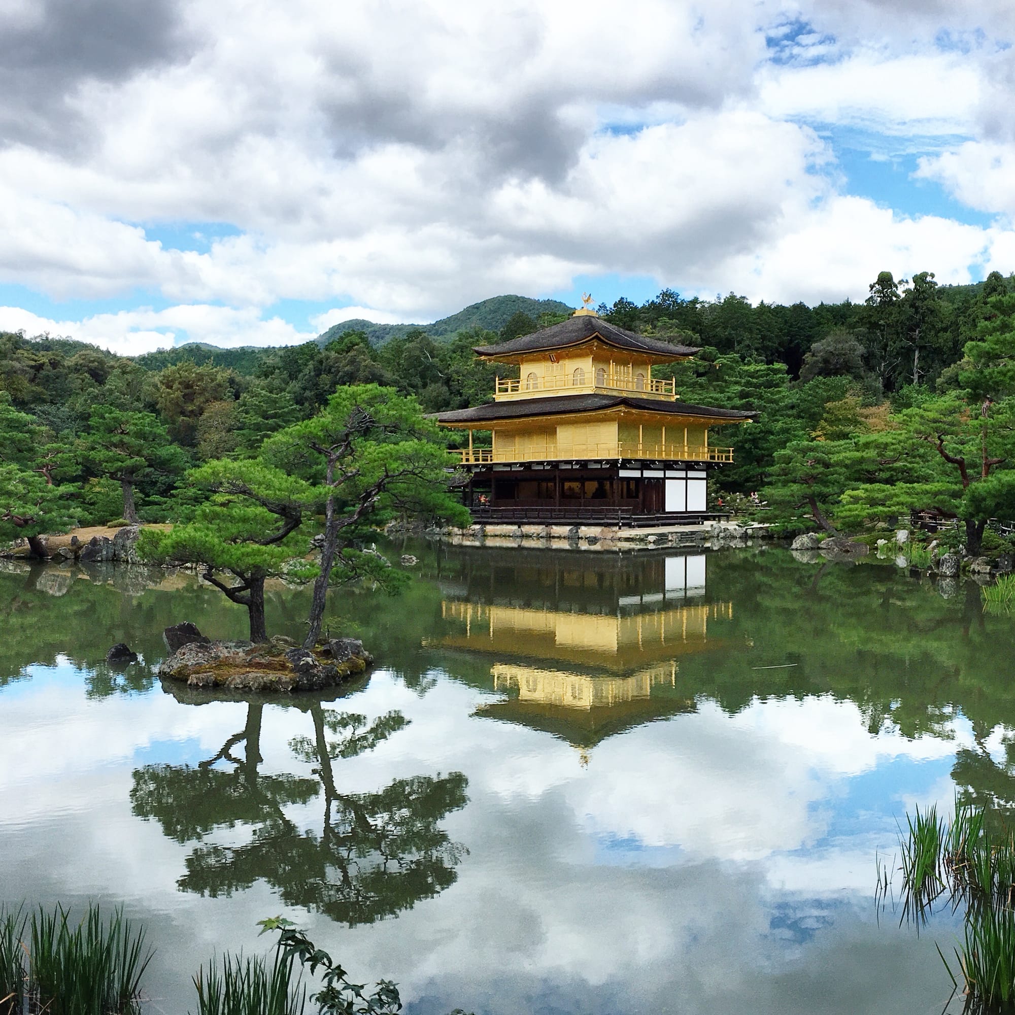 The Golden Pavilion Kinkaku-ji reflected in the mirror-still Kyoko-chi pond — Kyoto, Japan
