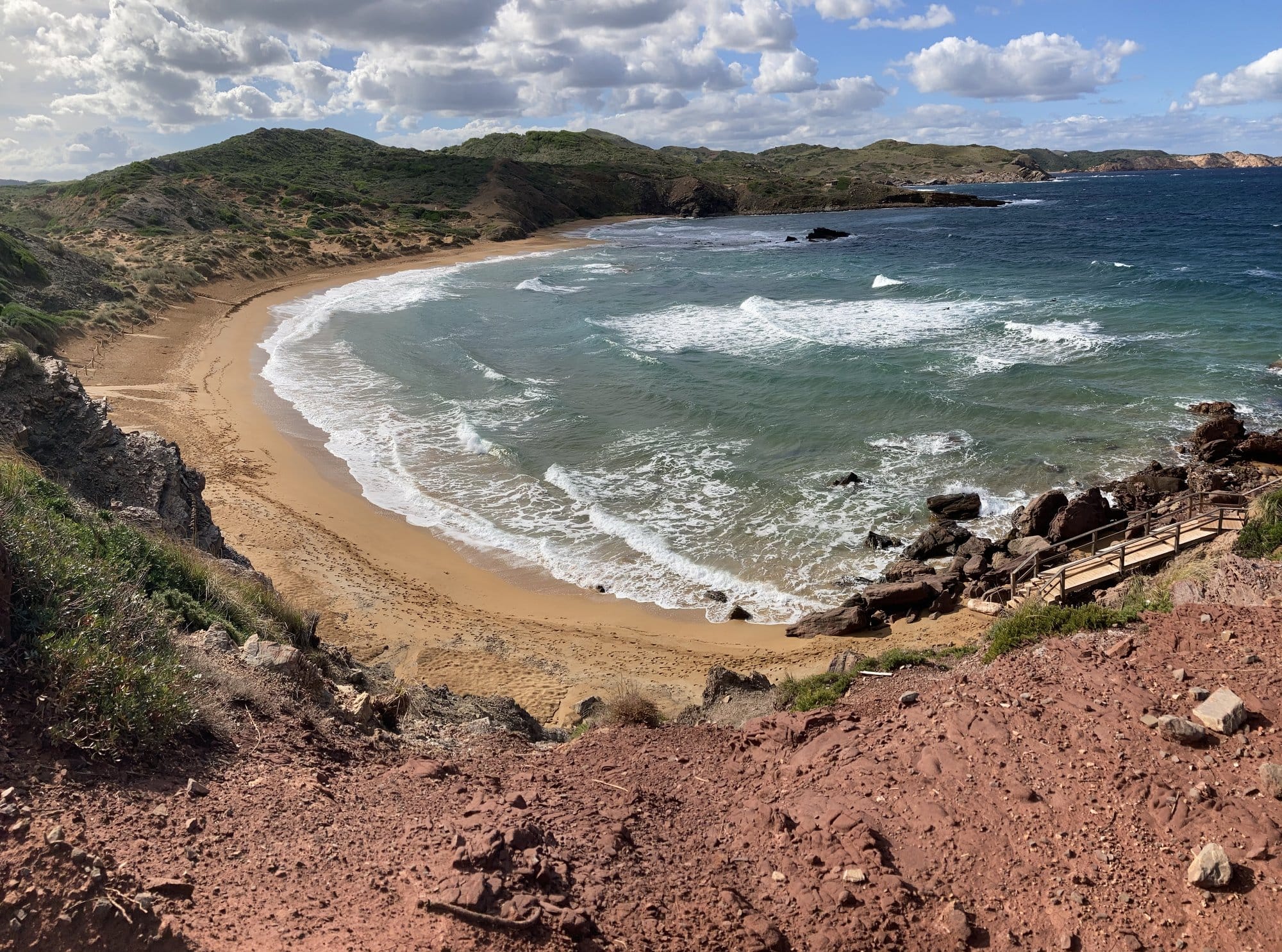 Golden cove with turquoise water and inviting sand — Sant Lluís, Spain