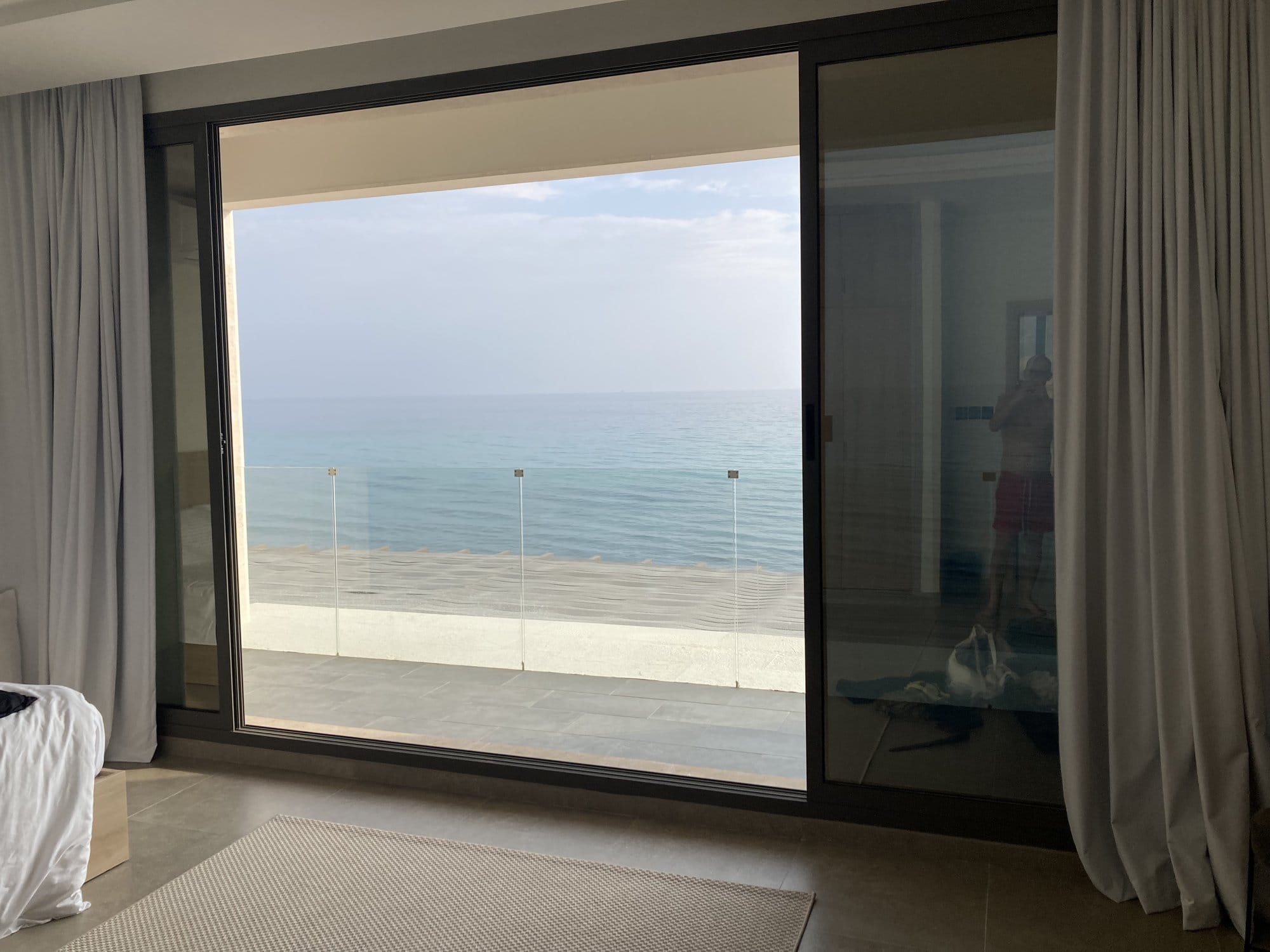 View of the turquoise sea from a hotel room window — Sur, Oman