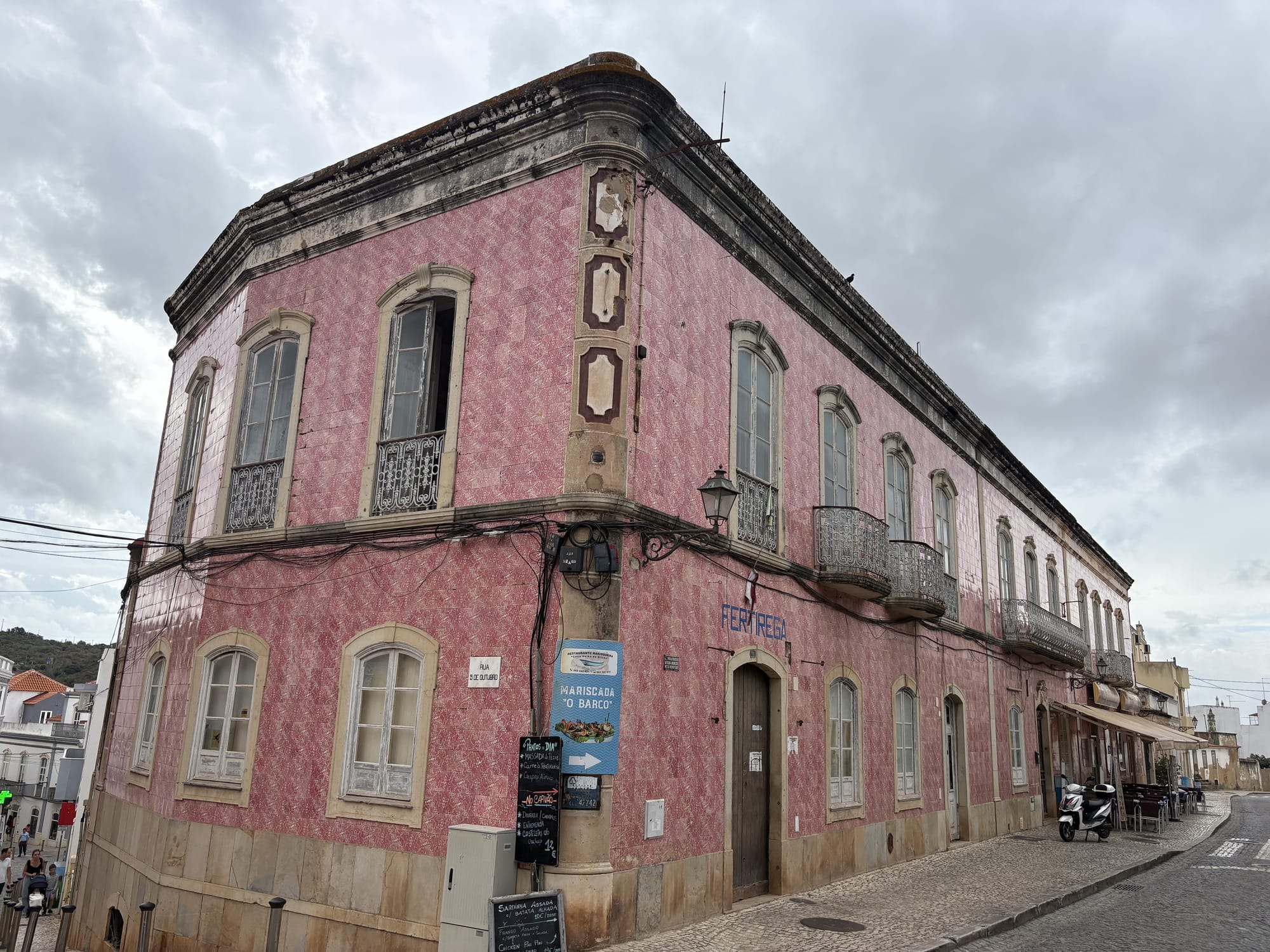 Pink historic building with traditional tilework in the old town — Silves, Algarve