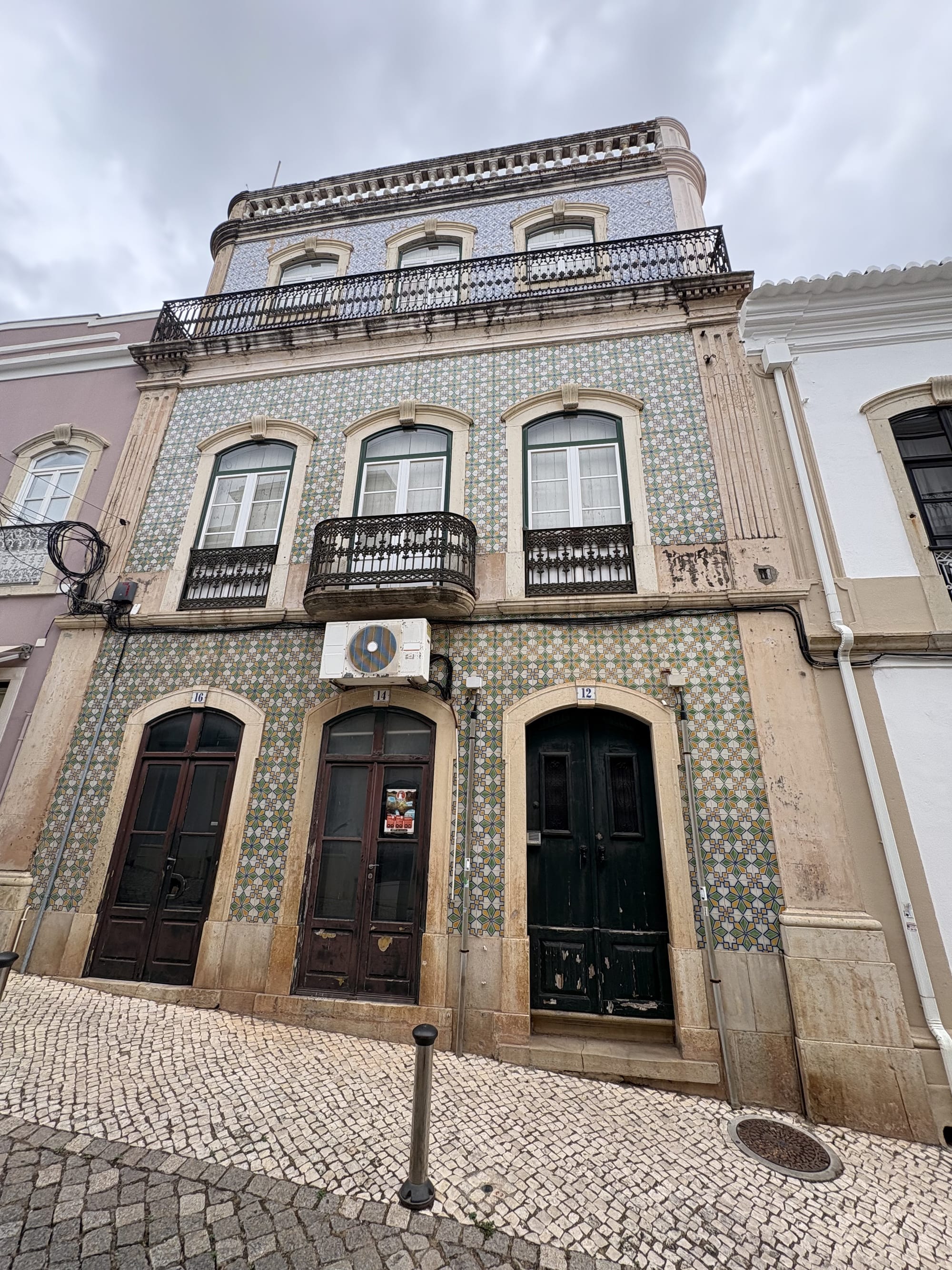 Traditional azulejo-tiled building on the cobbled streets — Silves, Algarve
