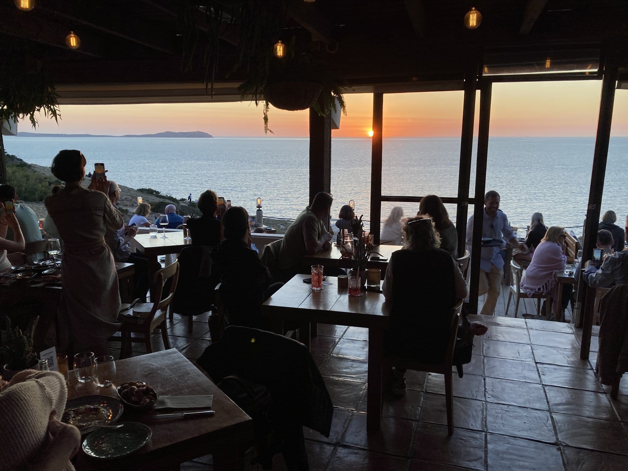 Beachfront restaurant at golden hour — Ibiza, Spain