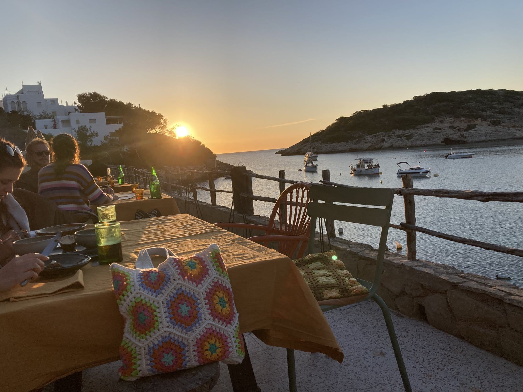 Clifftop terrace sunset dining — Ibiza, Spain