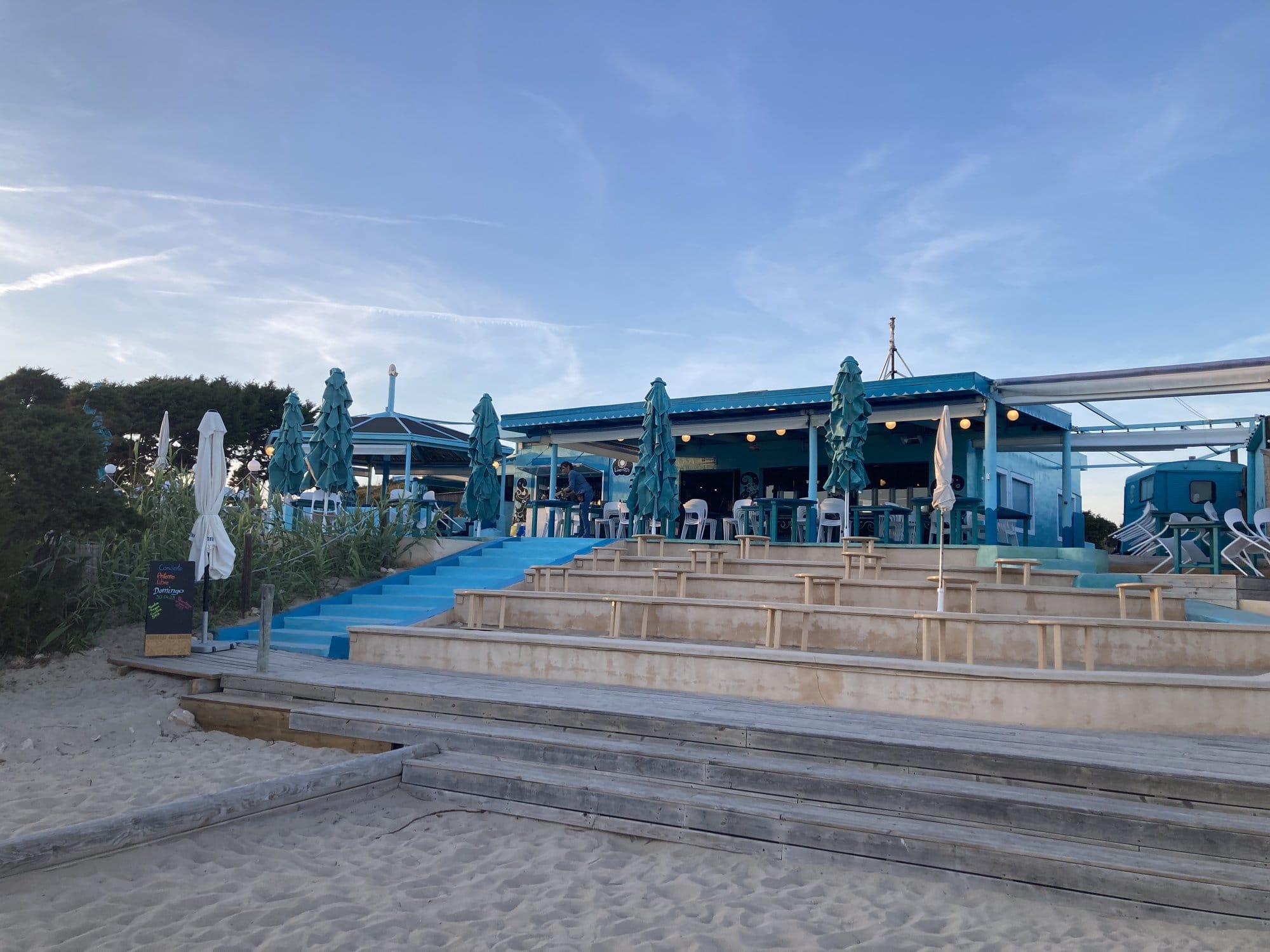 Blue beach club with umbrellas — Formentera, Spain