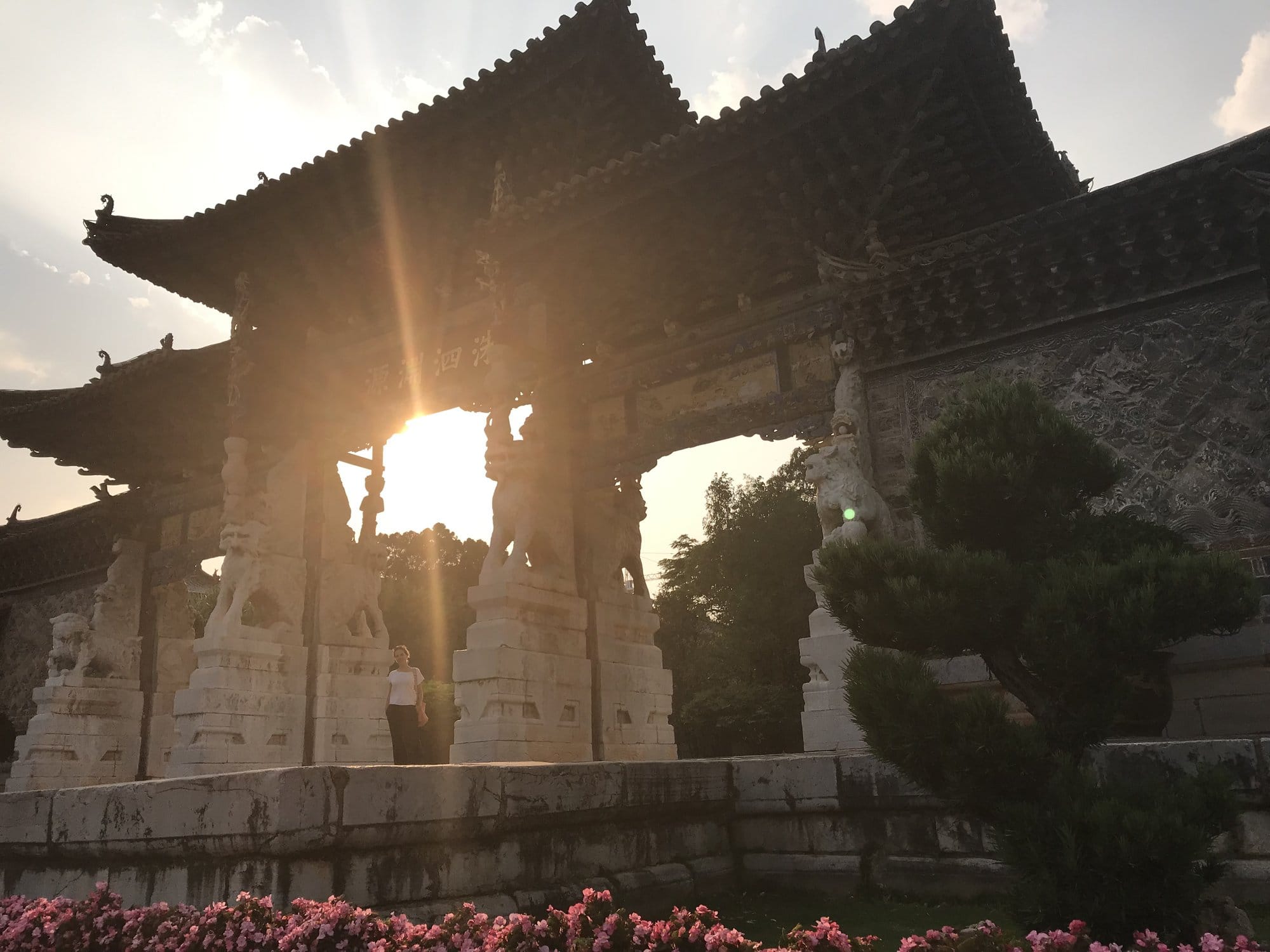 Late sun through one of the temple's stone ceremonial gates.