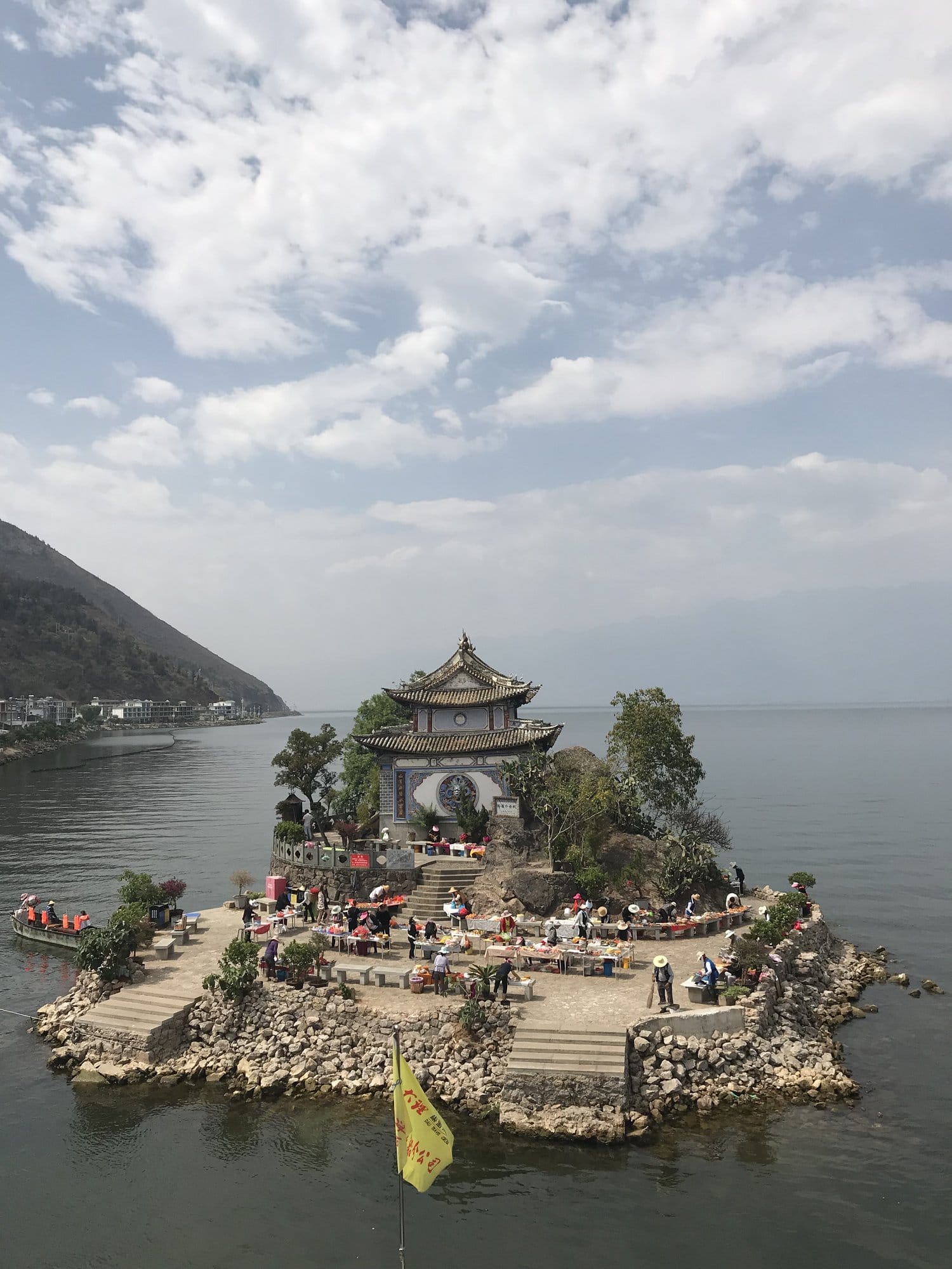 The islet of Xiaoputuo on Erhai Lake, its pavilion built on a rock offshore.