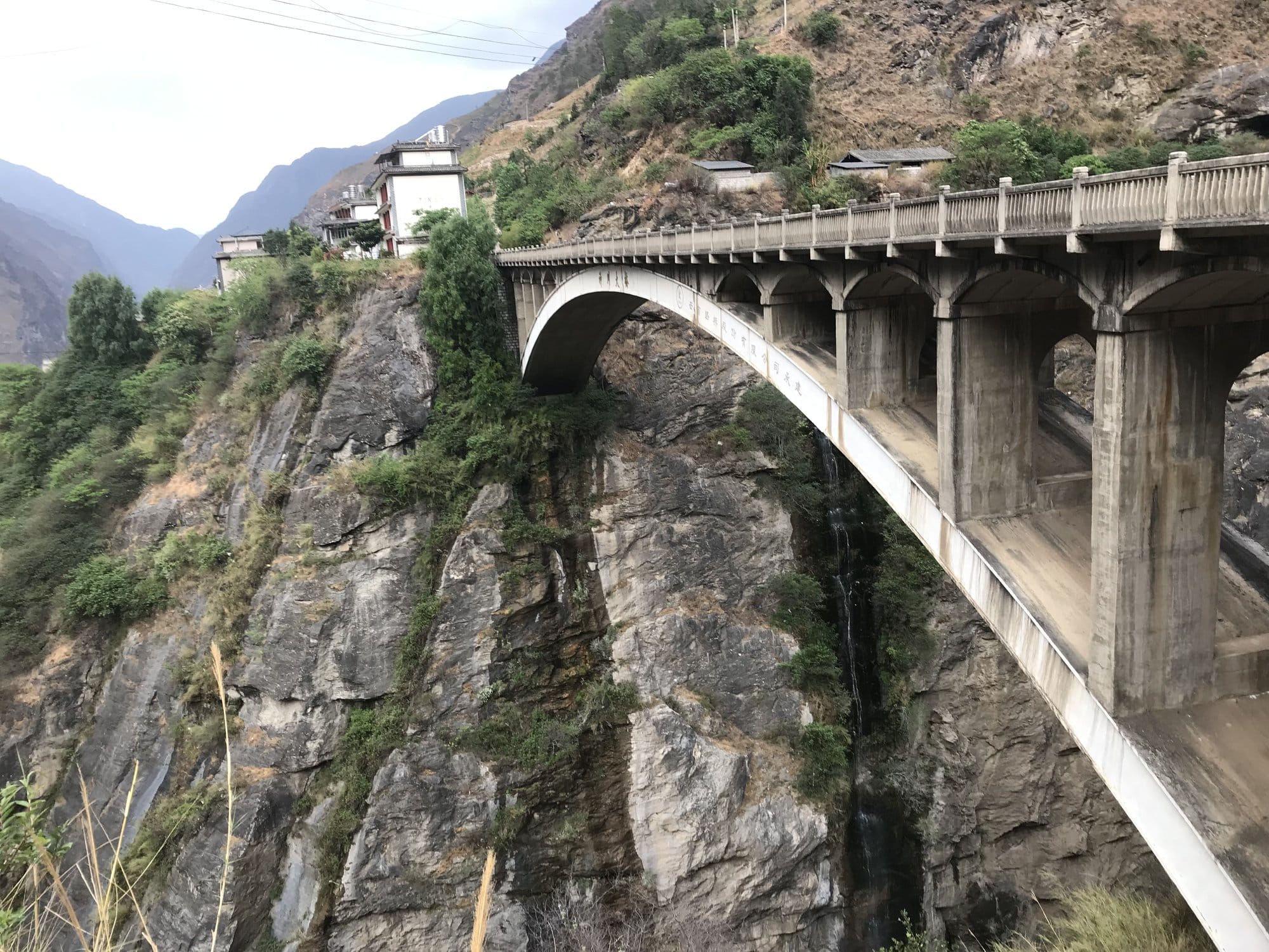 The arched road bridge across a side gorge near the end of the day's walking.