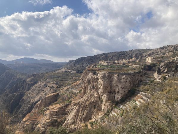 Terraced mountain valley with an ancient village on the Jebel Akhdar plateau — interior Oman
