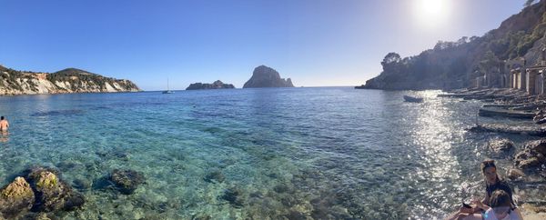 Turquoise cove on Ibiza's west coast with Es Vedrà on the horizon