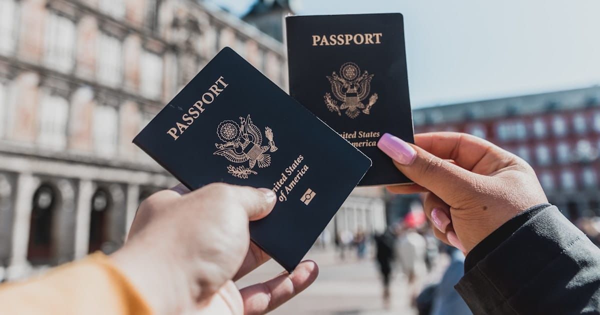 A passport and travel documents on a desk