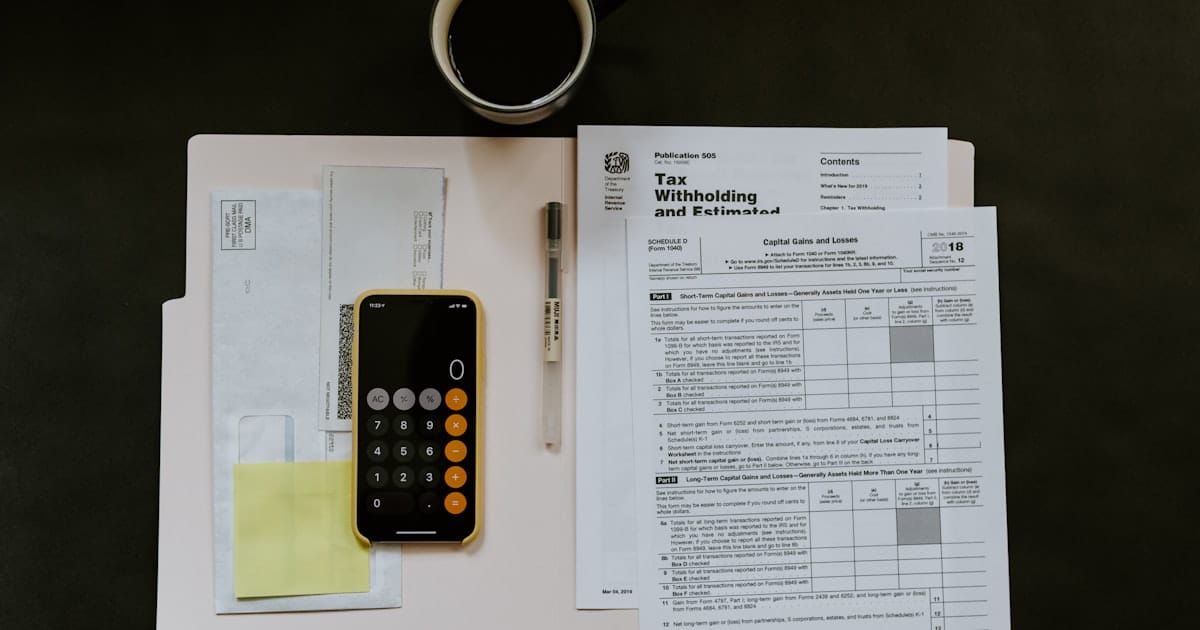 Calculator and tax documents on a desk