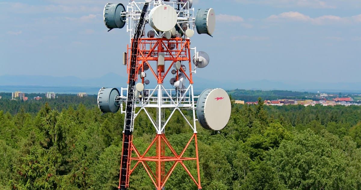 Cellphone tower against a blue sky